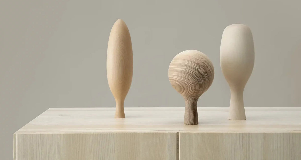 Three Wooden Trees by Nikari, showing three wooden trees in live shot.