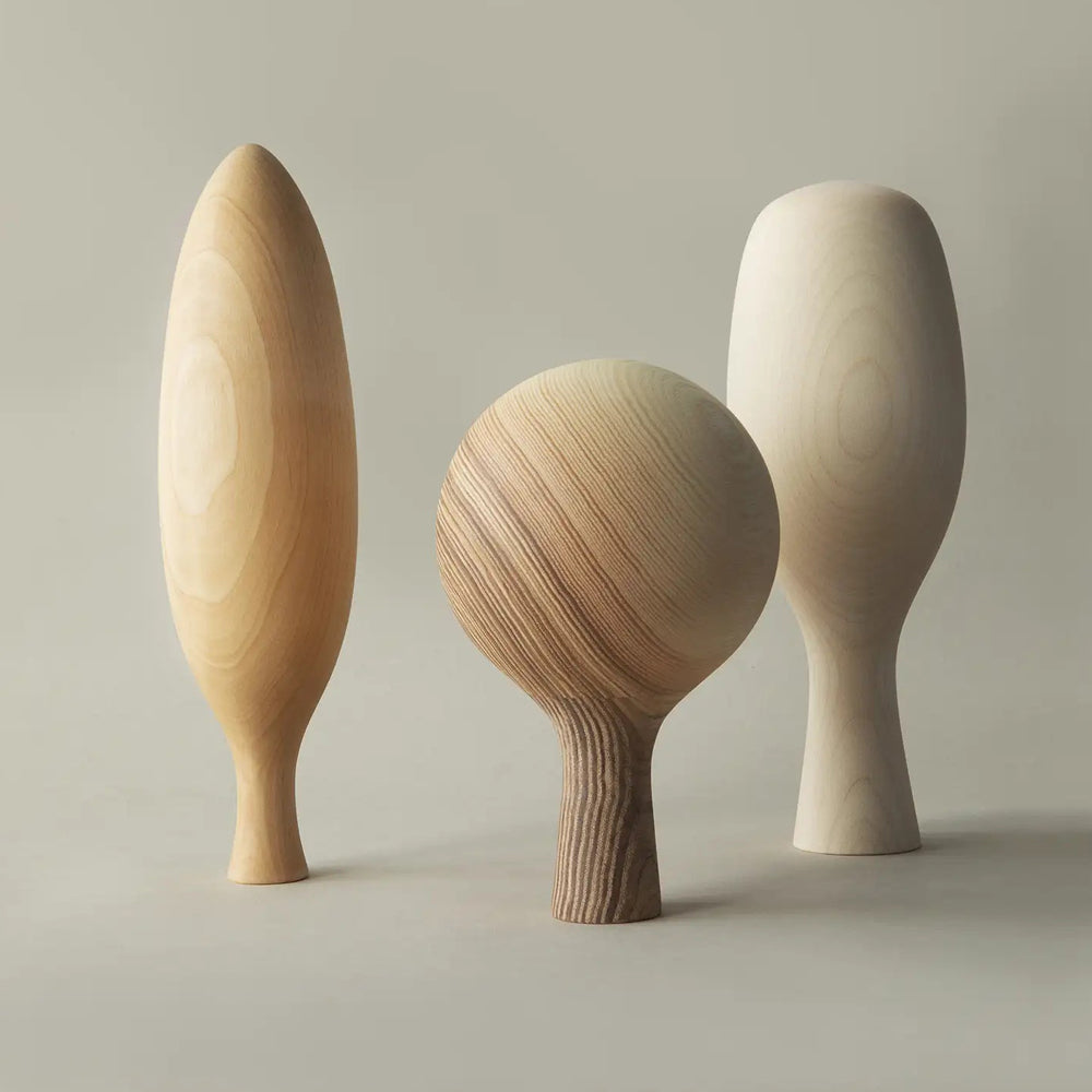 Three Wooden Trees by Nikari, showing three wooden trees in live shot.