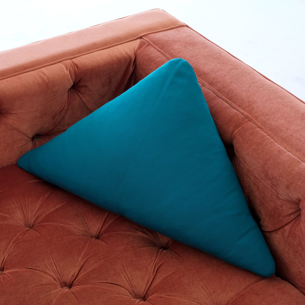 Round/Triangle/Arc Throw Pillow by Bend, showing throw pillow accessory in live shot.