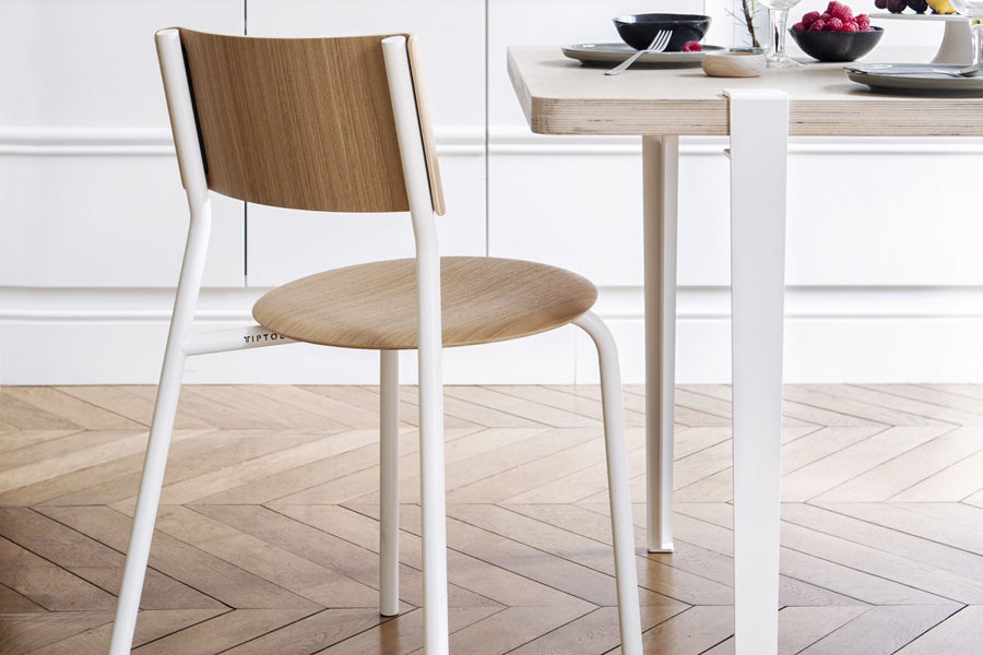 Tiptoe Dining Table by TipToe, showing closeup view of tiptoe dining table in live shot.