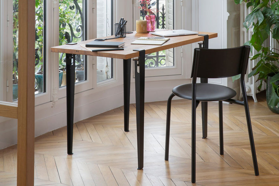 Tiptoe Dining Table by TipToe, showing tiptoe dining table in live shot.