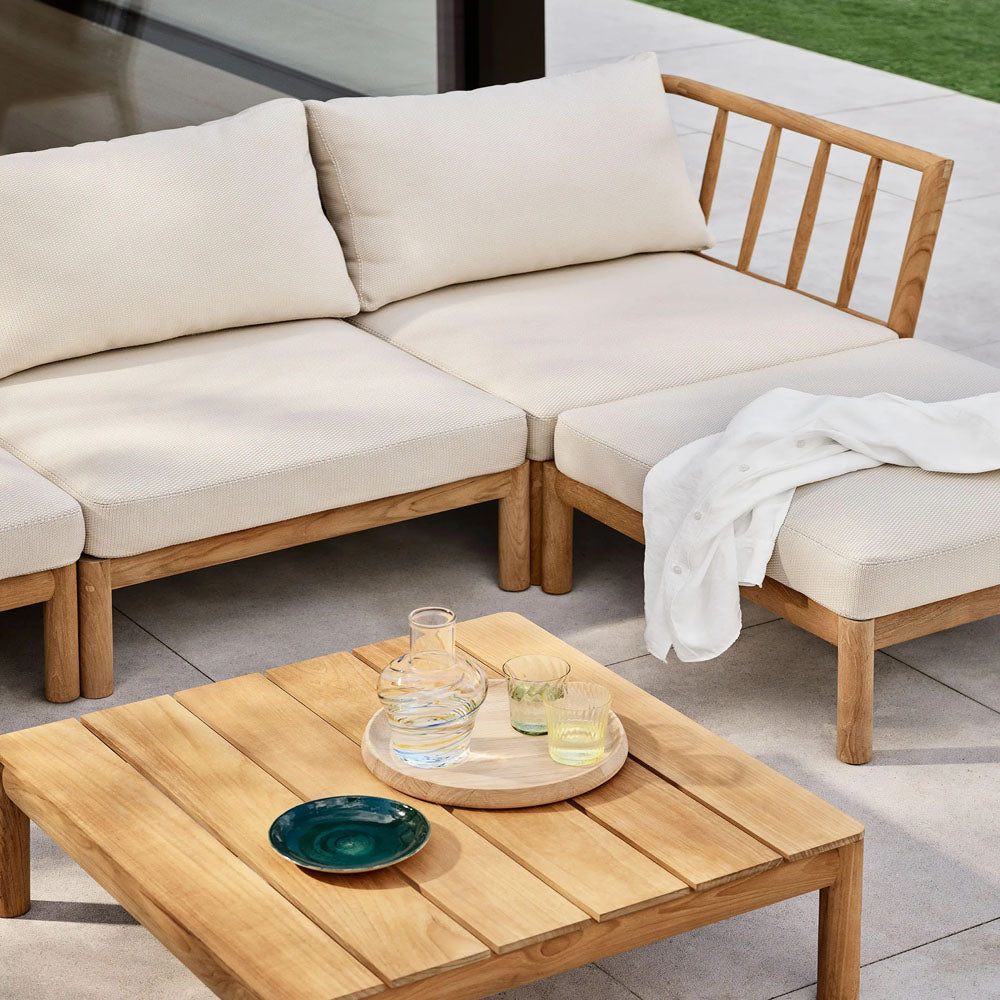 Tradition Lounge Table by Fritz Hansen, showing tradition lounge table in live shot.
