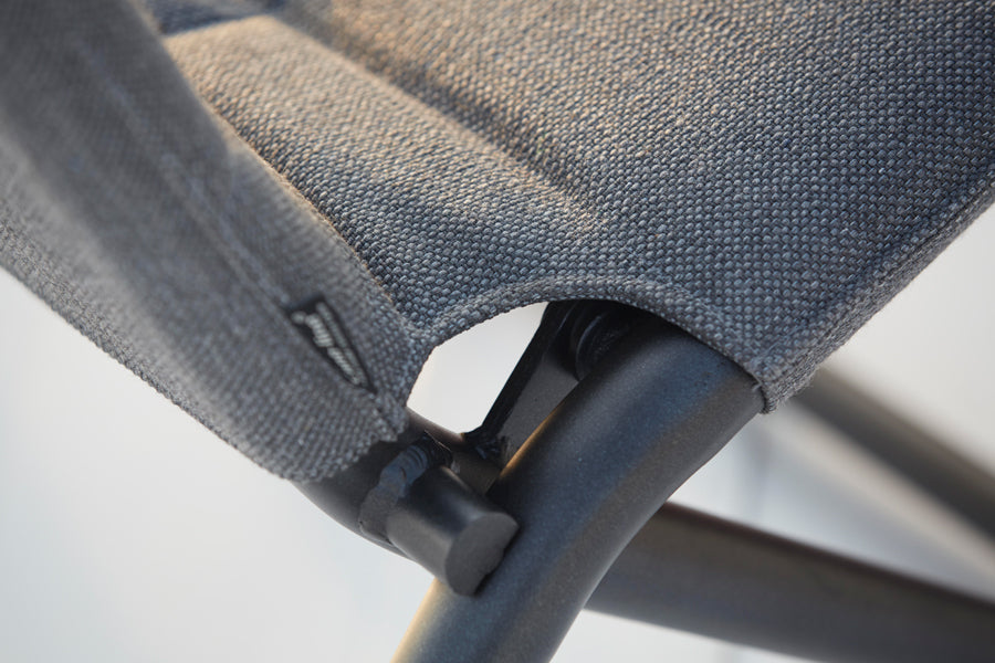Traveller Lounge Folding Chair by Cane-Line, showing closeup view of traveller lounge folding chair in live shot.