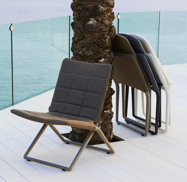 Traveller Lounge Folding Chair by Cane-Line, showing traveller lounge folding chairs in live shot.