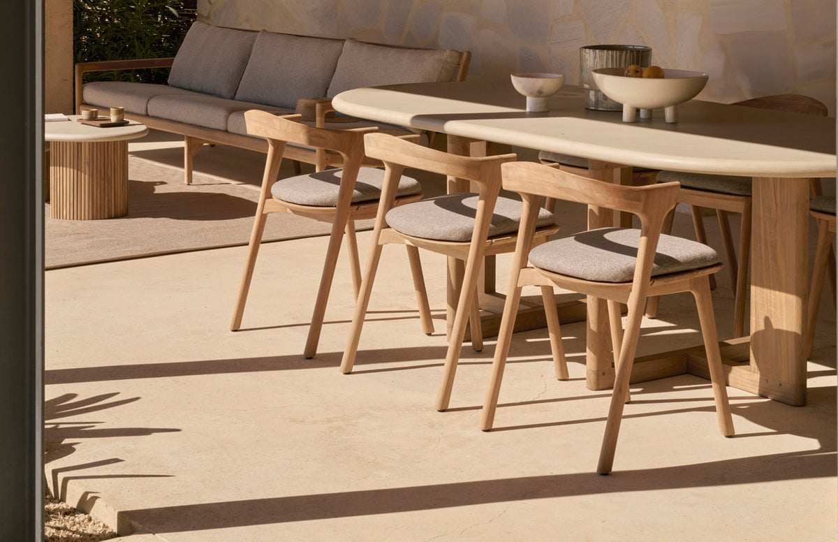 Trestle Outdoor Dining Table by Ethnicraft, showing trestle outdoor dining table in live shot.