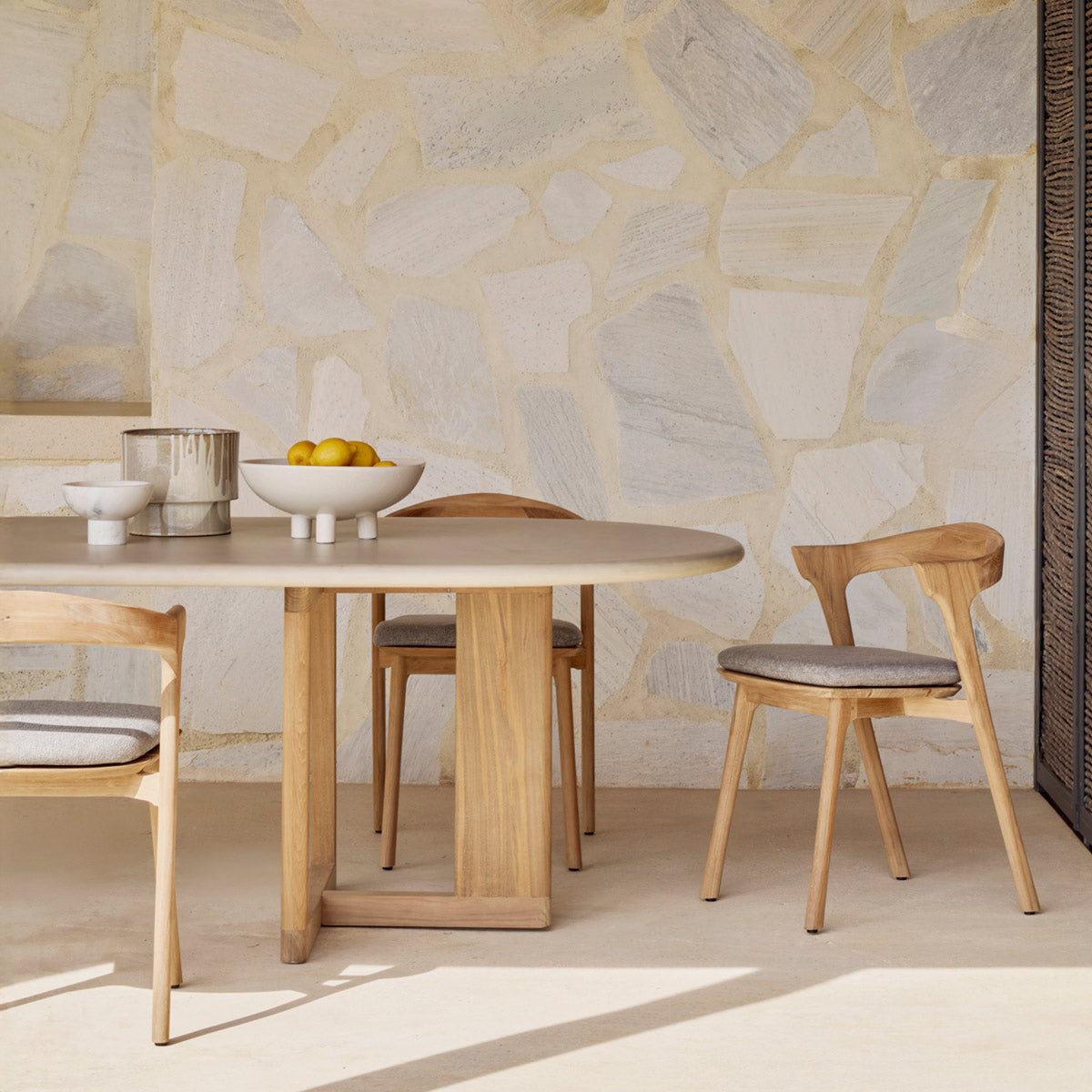 Trestle Outdoor Dining Table by Ethnicraft, showing closeup view of trestle outdoor dining table in live shot.