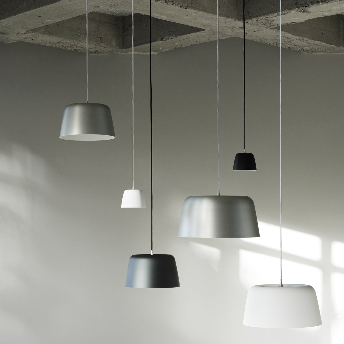 Tub Pendant Lamp by Normann Copenhagen, showing tub pendant lamps in live shot.