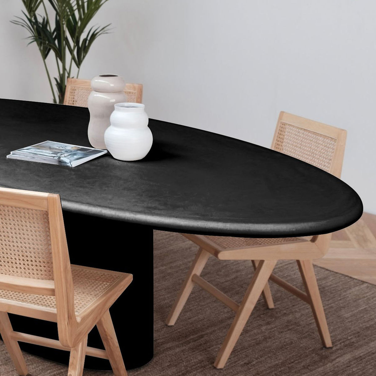 Tugg Oval Dining Table by Mobital, showing tugg oval dining table in live shot.