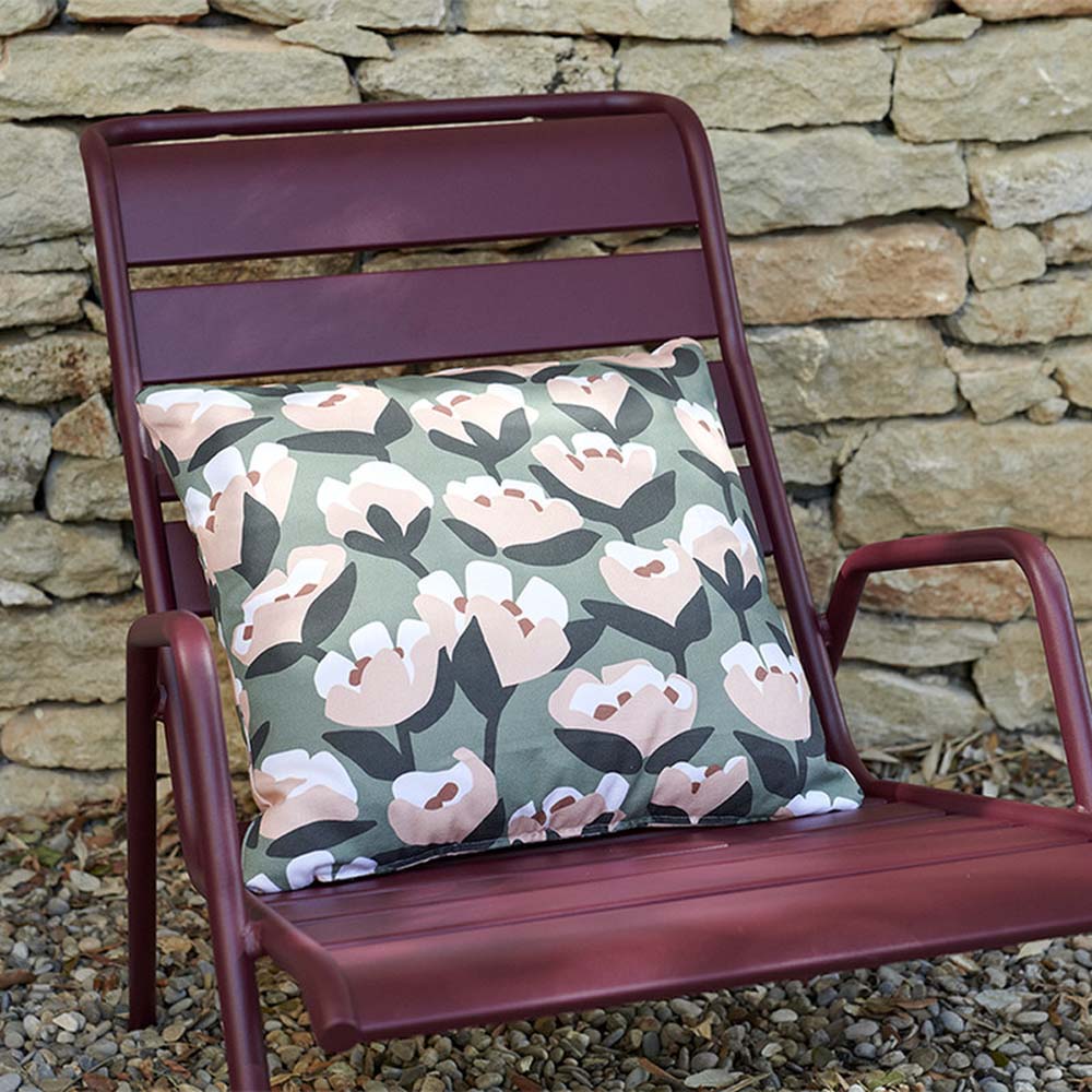 Tulip Outdoor Pillow by Fermob, showing tulip outdoor pillow in live shot.