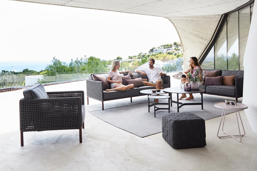 Twist Large Coffee Table by Cane-Line, showint twist large coffee table in live shot.