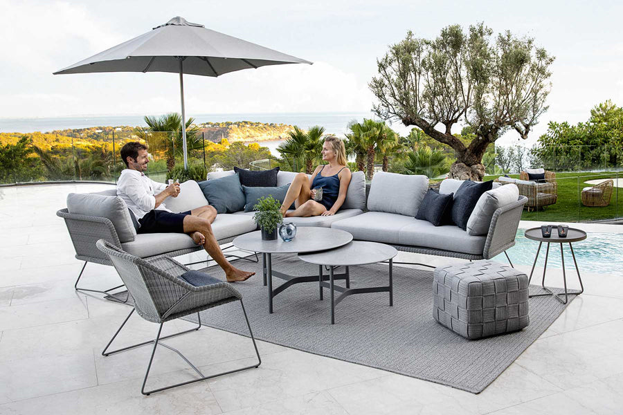 Twist Large Coffee Table by Cane-Line, showint twist large coffee table in live shot.