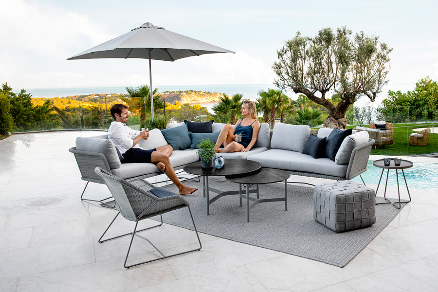 Twist Medium Coffee Table by Cane-Line, showing twist medium coffee table in live shot.