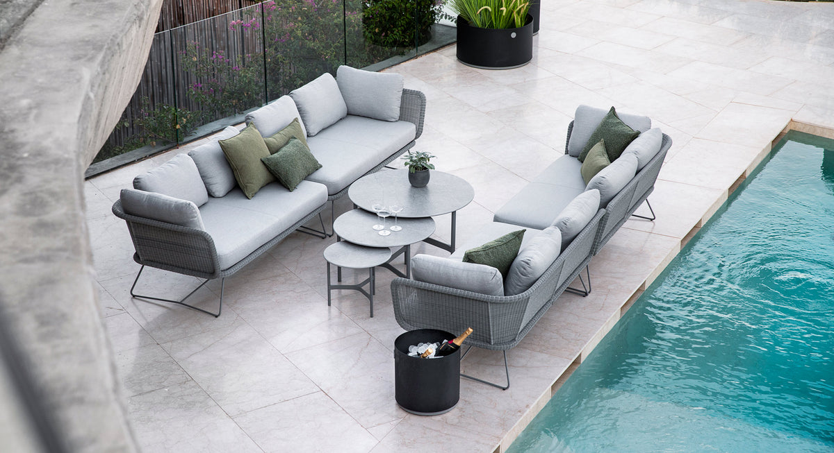 Twist Medium Coffee Table by Cane-Line, showing twist medium coffee table in live shot.