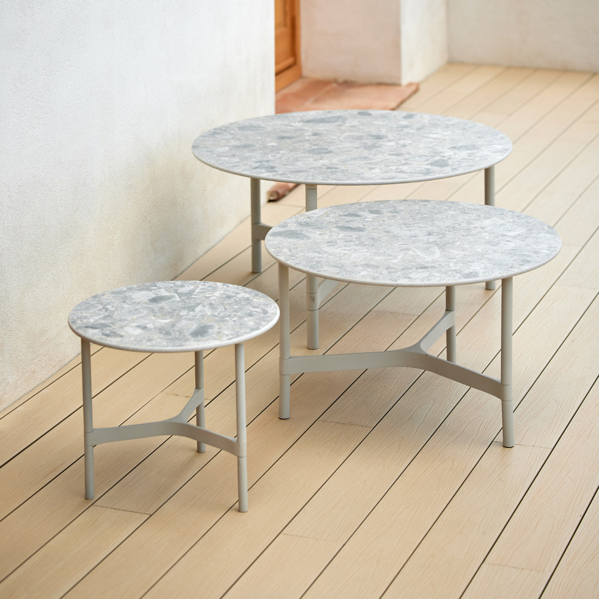 Twist Medium Coffee Table by Cane-Line, showing twist medium coffee table in live shot.