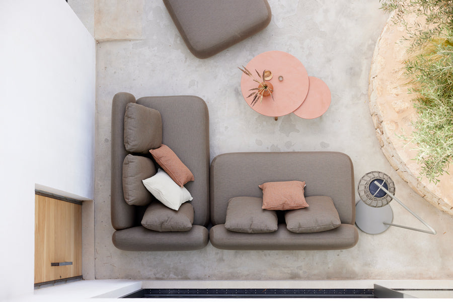 Twist Medium Coffee Table by Cane-Line, showing twist medium coffee table in live shot.