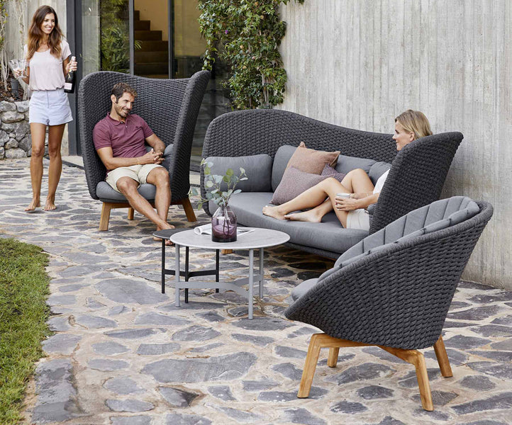 Twist Medium Coffee Table by Cane-Line, showing twist medium coffee table in live shot.