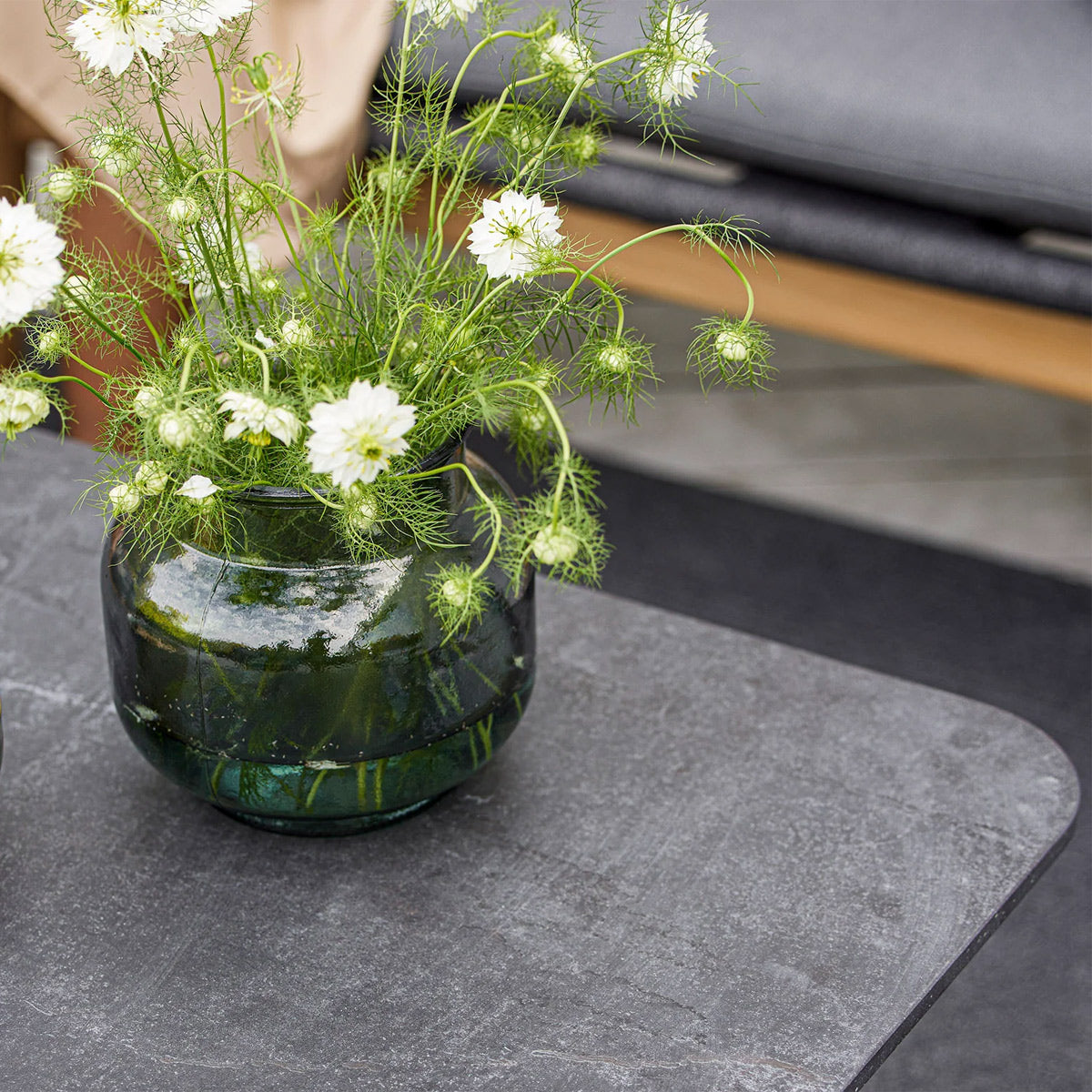 Twist Rectangular Coffee Table by Cane-Line, showing closeup view of twist rectangular coffee table in live shot.