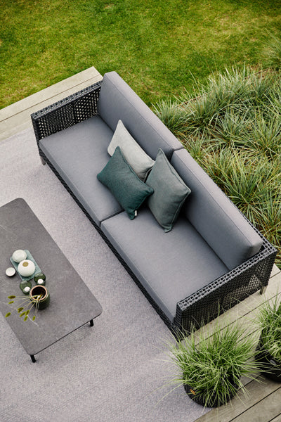 Twist Rectangular Coffee Table by Cane-Line, showing closeup view of twist rectangular coffee table in live shot.