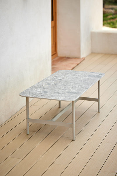 Twist Rectangular Coffee Table by Cane-Line, showing twist rectangular coffee table in live shot.