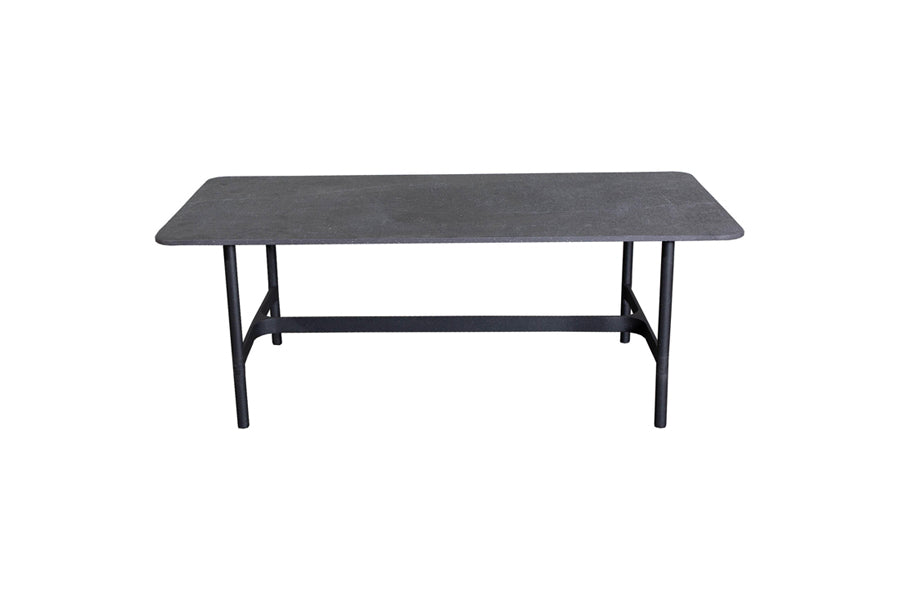 Twist Rectangular Coffee Table by Cane-Line, showing front view of twist rectangular coffee table in lava grey aluminum */black fossil ceramic *.