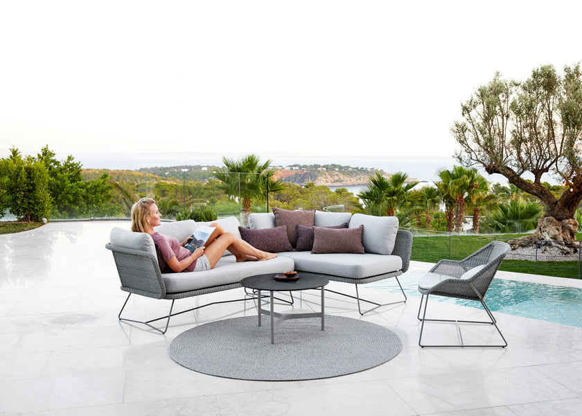 Twist Coffee Table by Cane-Line, showing twist coffee table in live shot.