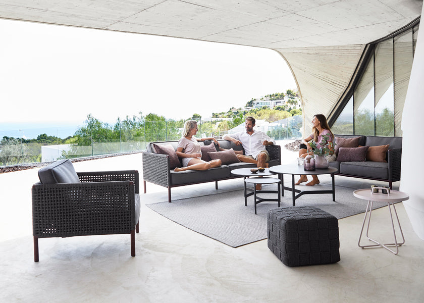 Twist Coffee Table by Cane-Line, showing twist coffee table in live shot.