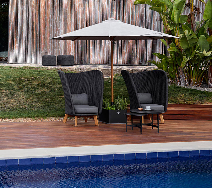 Twist Coffee Table by Cane-Line, showing twist coffee table in live shot.