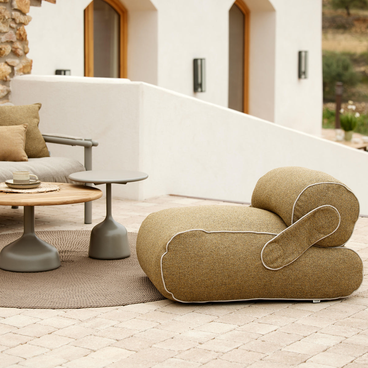 Unite Lounge Chair by Cane-Line, showing unite lounge chair in live shot.