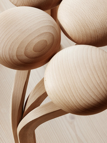 Utzon Stool by Fritz Hansen, showing closeup view of utzon stool in live shot.