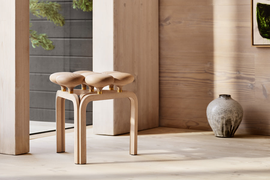 Utzon Stool by Fritz Hansen, showing utzon stool in live shot.