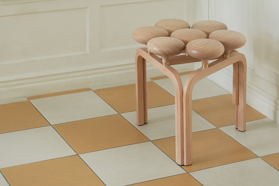 Utzon Stool by Fritz Hansen, showing utzon stool in live shot.