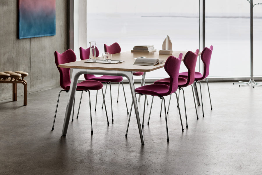 Utzon Stool by Fritz Hansen, showing closeup view of utzon stool in live shot.