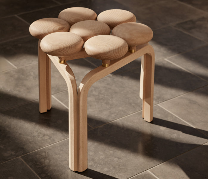 Utzon Stool by Fritz Hansen, showing utzon stool in live shot.