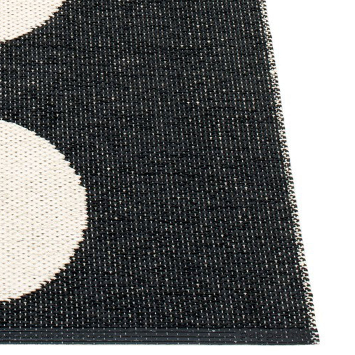 Vera One Black & Vanilla Rug by Pappelina, showing closeup view of vera one black & vanilla rug.
