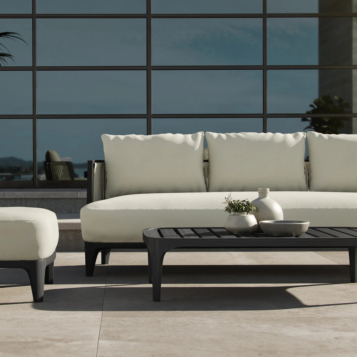 Veyra Outdoor Sofa by Viesso, showing closeup view of veyra outdoor sofa in live shot.