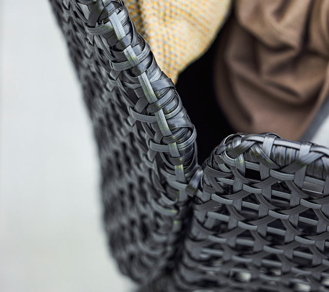 Vibe Highback Chair by Cane-Line, showing closeup view of vibe highback chair in live shot.