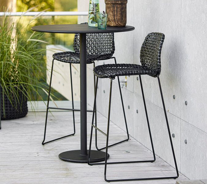 Vibe Stackable Bar Chair by Cane-Line, showing vibe stackable bar chairs in live shot.