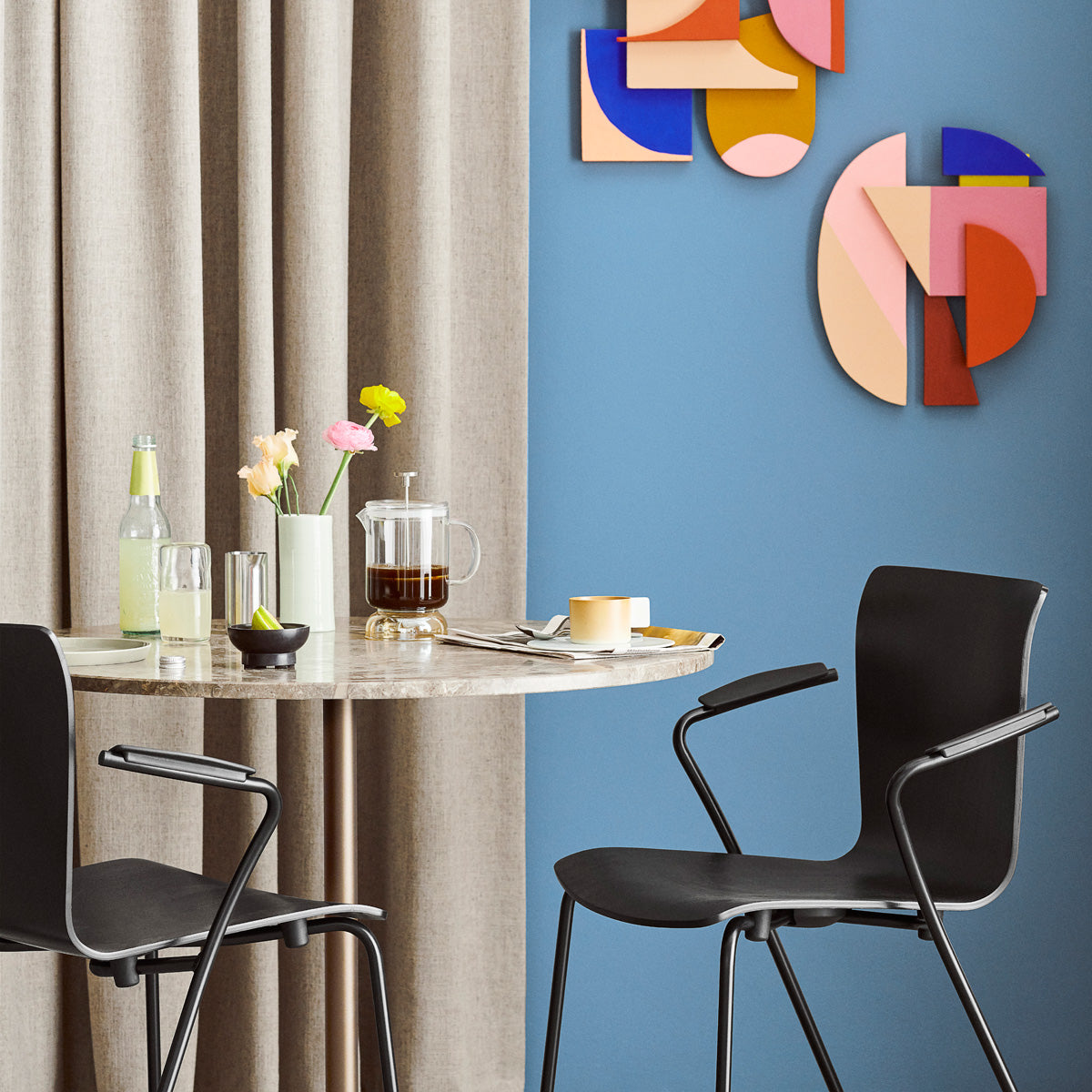 Vico Duo Armchair by Fritz Hansen, showing closeup view of vico duo armchairs in live shot.