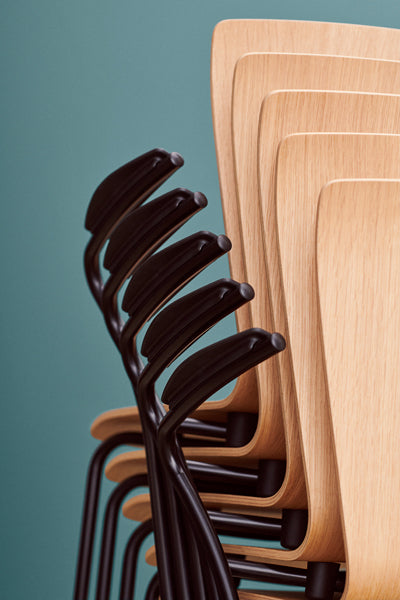 Vico Duo Armchair by Fritz Hansen, showing closeup view of vico duo armchairs in live shot.