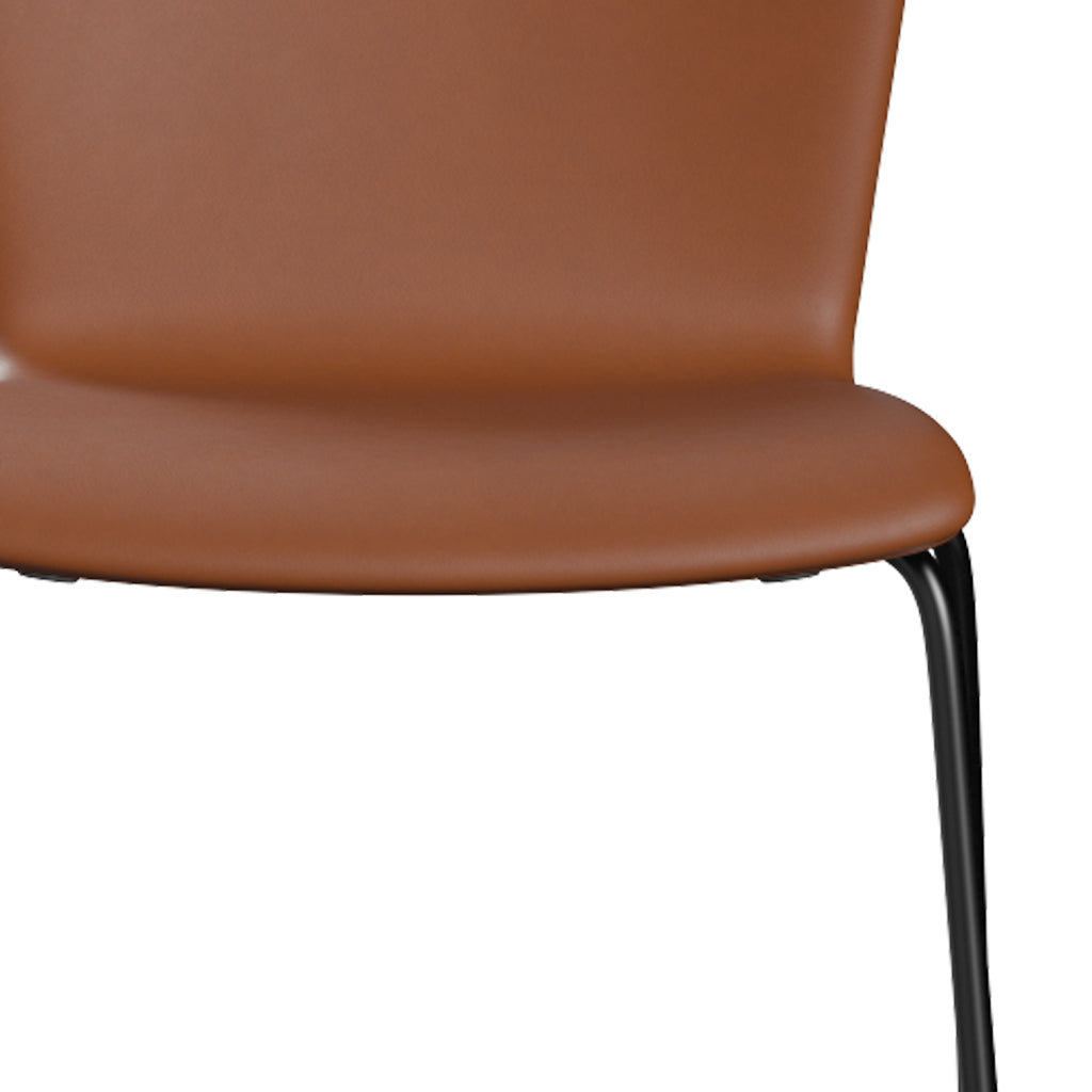 Vico Duo Full Upholstery Chair by Fritz Hansen, showing closeup view of vico duo full upholstery chair in black powder coated steel/leather category 3.