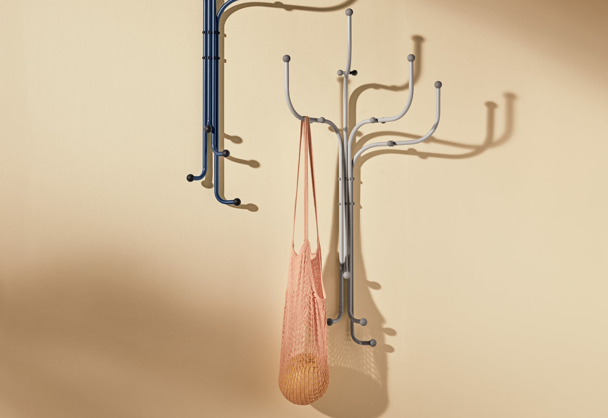 Wall Coat Tree by Fritz Hansen, showing wall coat trees in live shot.