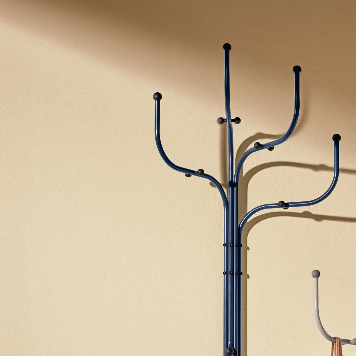 Wall Coat Tree by Fritz Hansen, showing closeup view of wall coat trees in live shot.