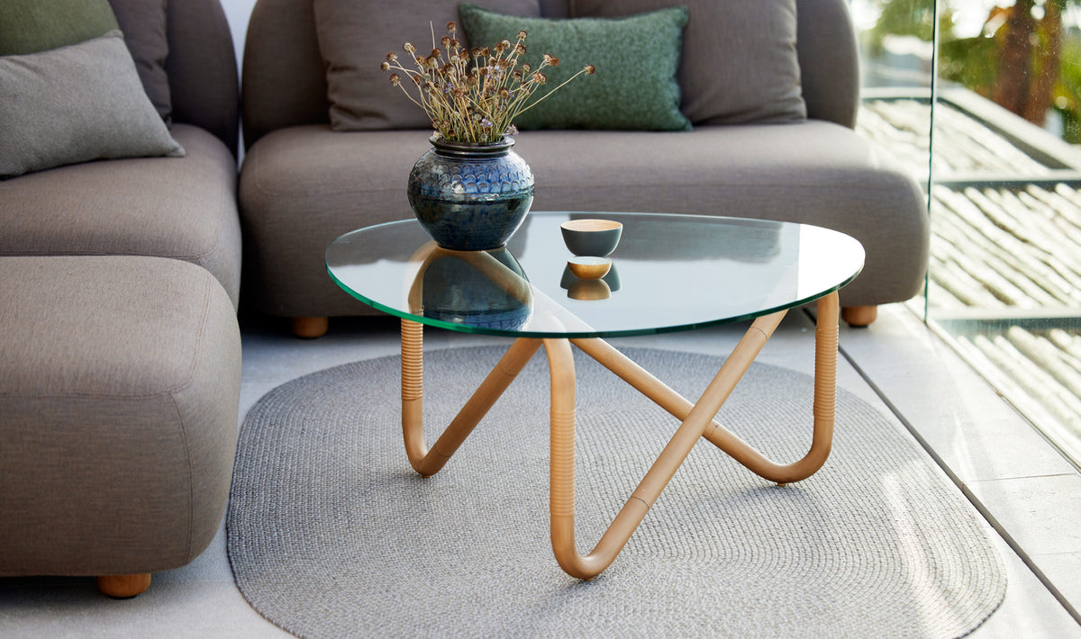Wave Outdoor Coffee Table by Cane-Line, showing wave outdoor coffee table in live shot.