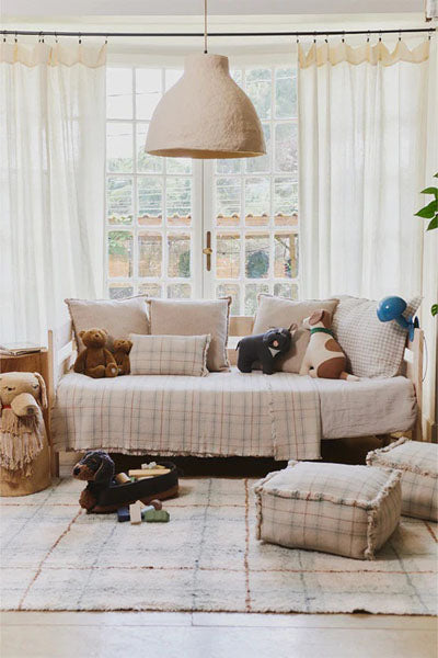 Wouf Handloom Pouf by Lorena Canals, showing wouf handloom pouf in live shot.