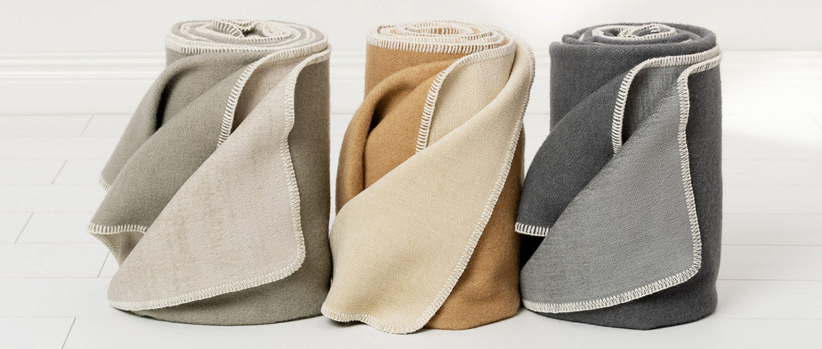 Ylva dark Grey & Charcoal Blanket by Pappelina, showing of ylva dark grey & charcoal blanket in live shot.
