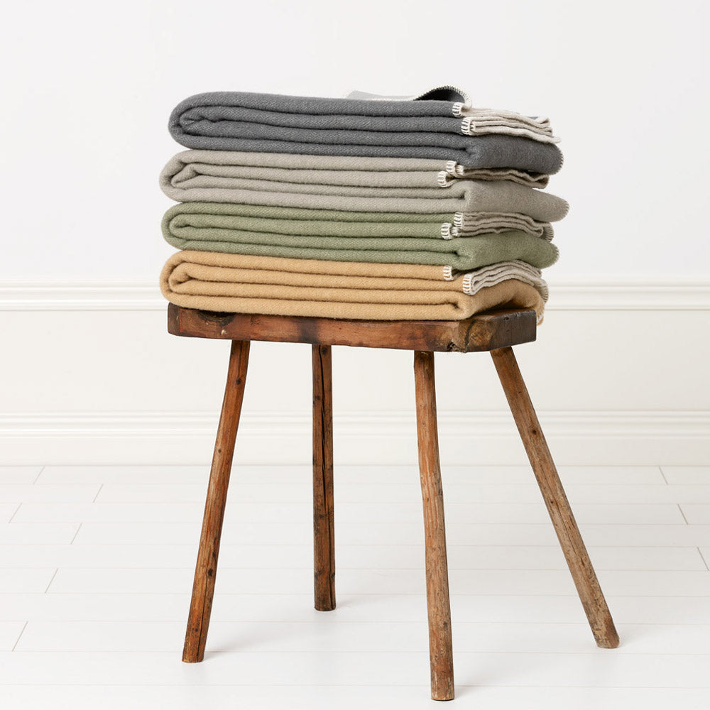 Ylva dark Grey & Charcoal Blanket by Pappelina, showing of ylva dark grey & charcoal blanket in live shot.