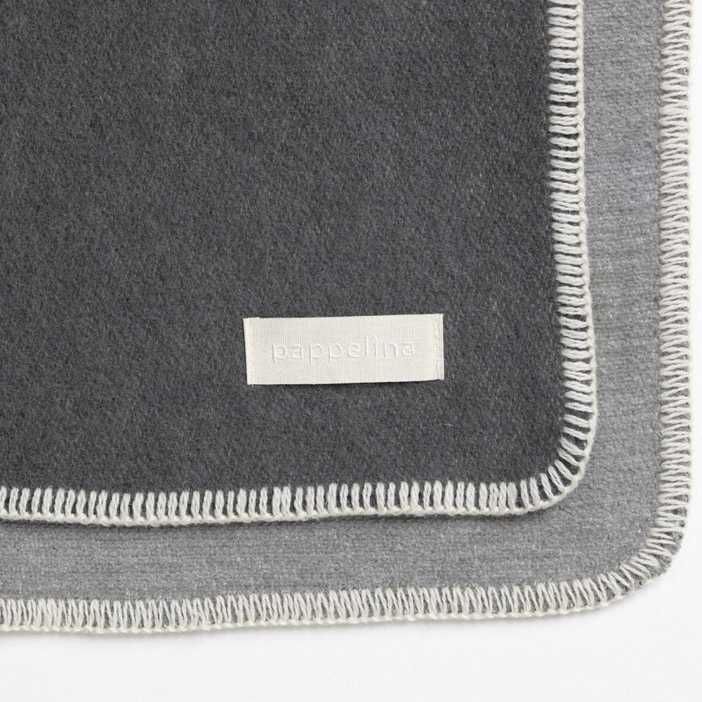 Ylva dark Grey & Charcoal Blanket by Pappelina, showing detail view of ylva dark grey & charcoal blanket.
