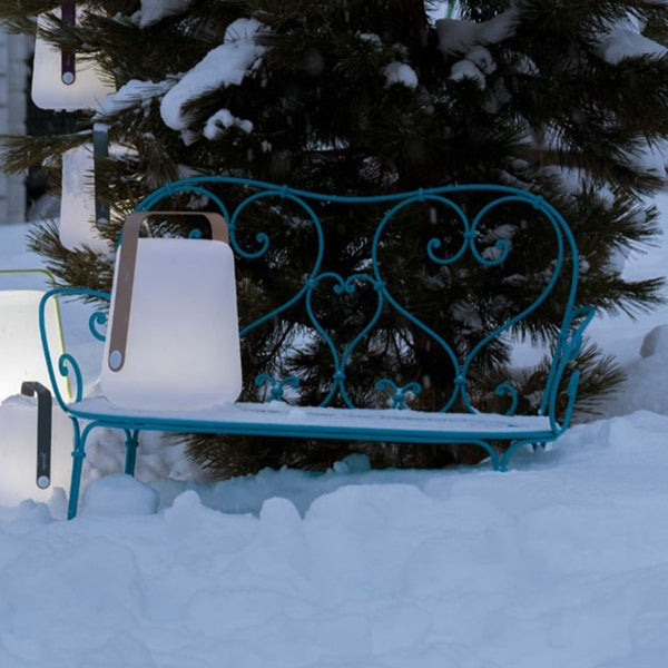 1900 Bench by Fermob, showing front view of the bench with lamp in the live shot.