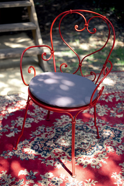 1900 Stacking Armchair by Fermob, showing front view of the armchair.