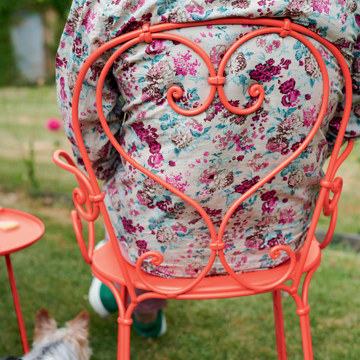 1900 Stacking Armchair by Fermob, showing back view of stacking armchair in live shot.